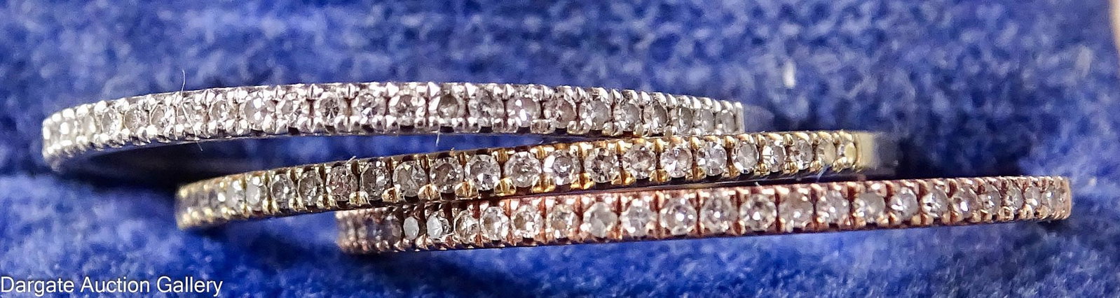 (3) 14k GOLD DIAMOND BANDS: (3) 14k gold bands in rose, yellow and white gold, each marked [14k] and set with small diamonds, all size 6.5, total gross weight 2.3g