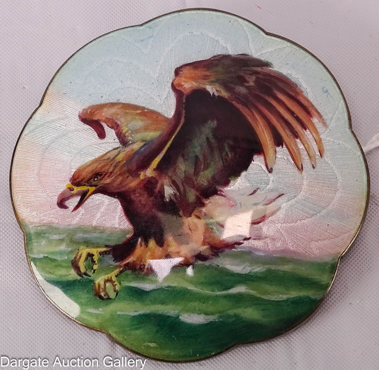 GUSTAV GAUDERNECK STELRING GUILLOCHE ENAMEL BROOCH: Gustav Gauderneck (Oslo Norway, 1890-1938) circa 1930's; scalloped edge depicts and eagle in flight; signed en verso [G.G. 925S N.M.]; Measures - 2.25" diameter