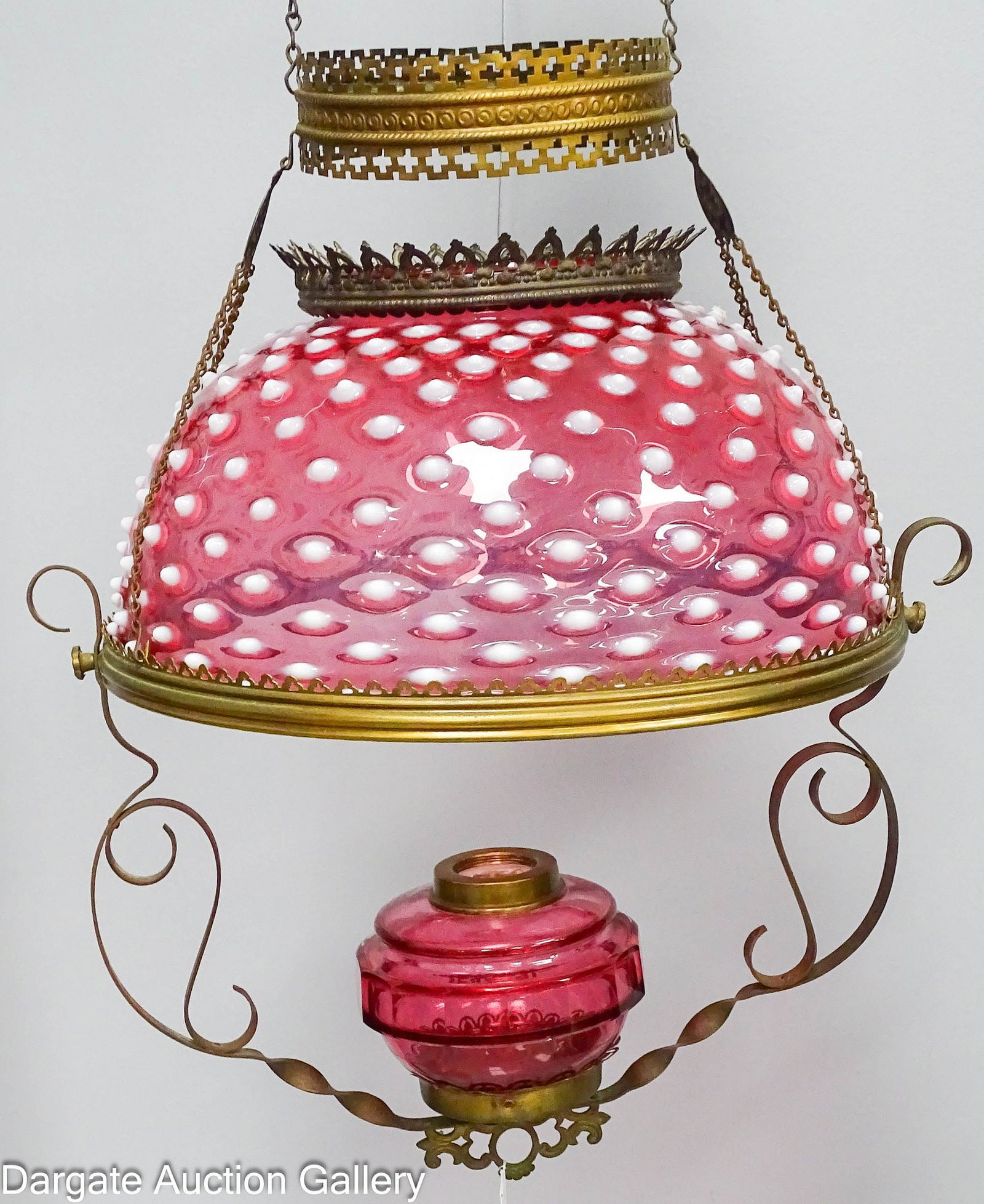 19th C BRASS FRAME KEROSENE HANGING PARLOR LIBRARY LAMP: Victorian ceiling light fixture with ornate brass frame with adjustable weight and pully system; Cranberry opalescent hobnail umbrella shade and cranberry font; has not been electrified; Measures: Lam