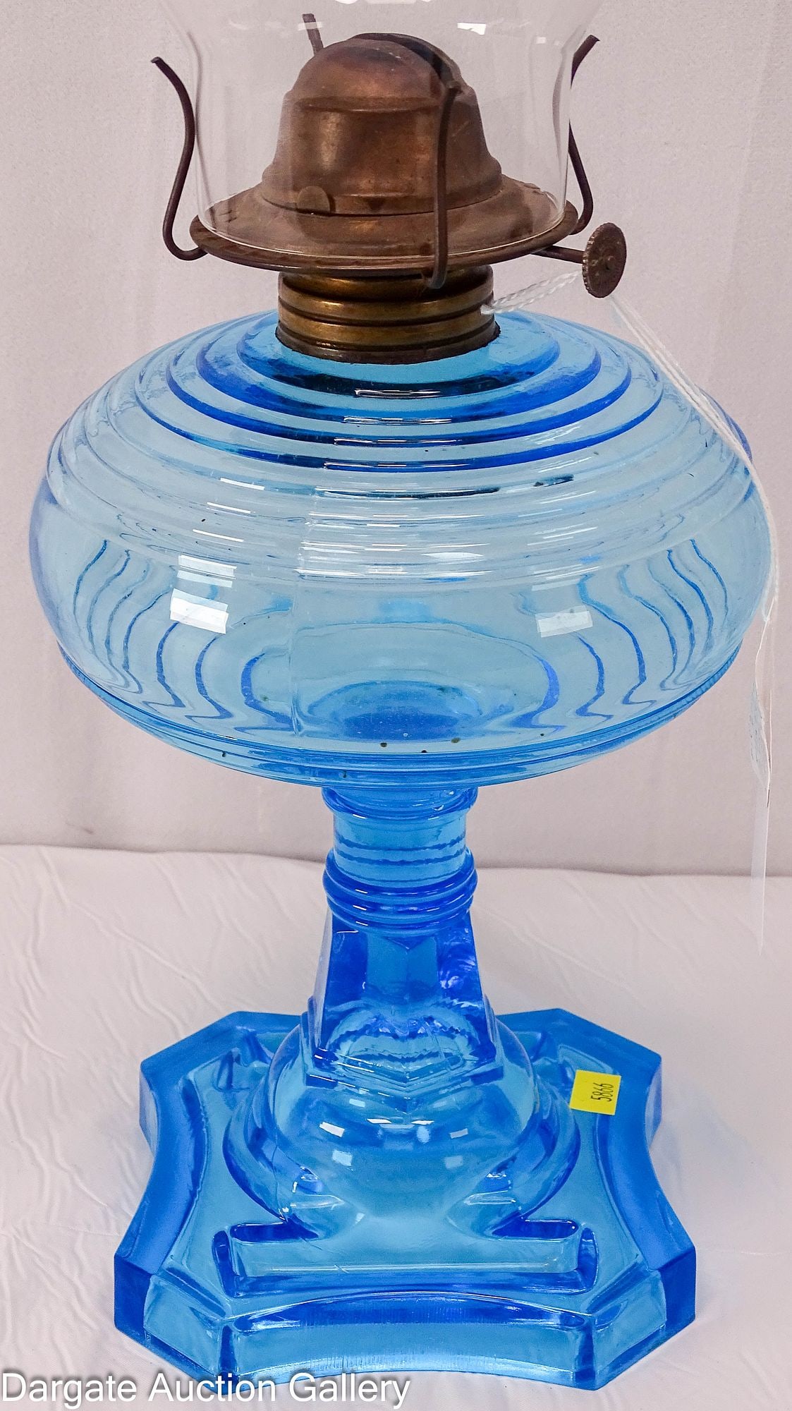 VICTORIAN MATCH HOLDER BASE BLUE GLASS OIL LAMP: Peacock blue oil lamp with match holders molded into the base, advertised in the 1890s by French, Poller and Wilson; Below the depressions for holding matches is a series of fine lines that serve
