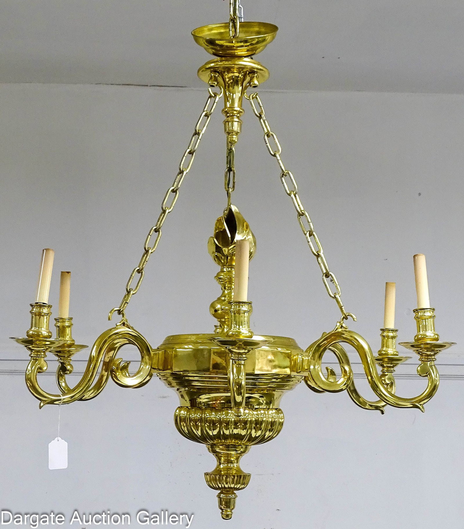 MODERN GEORGIAN HEAVY BRASS CHANDELIER: Georgian Style highly polished brass 6-arm chandelier with large flame (flambeau) finial; Scrolled arms with a 3-chain support from top cap; this is very heavy; Measures - 26"H x 36"W;