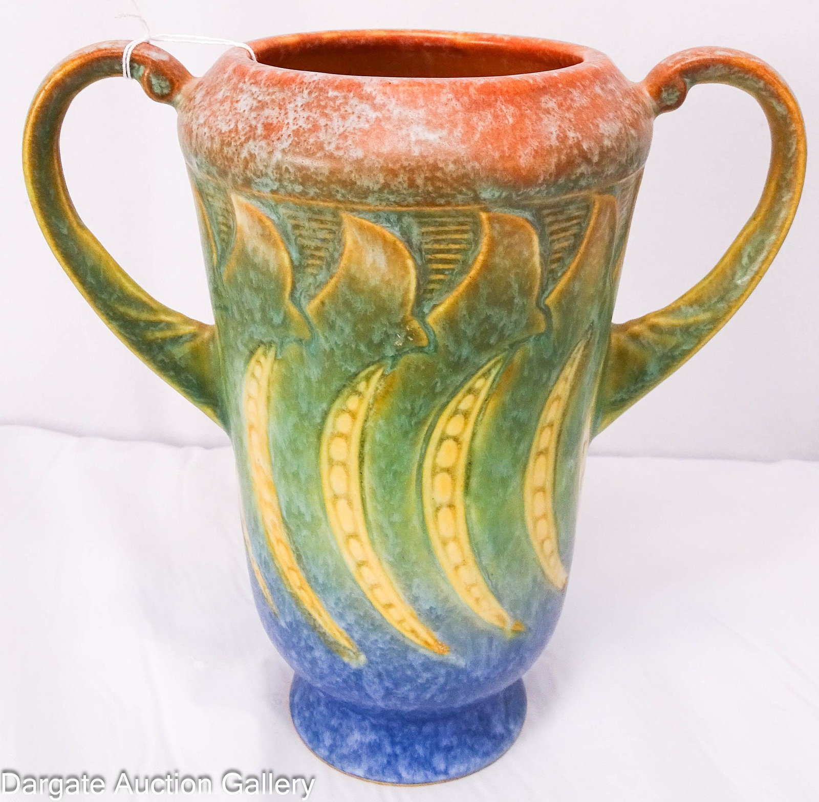 ROSEVILLE FALLINE BLUE 1933 ART POTTERY VASE: Roseville Arts & Crafts style Falline (Pea Pod) pattern circa 1933, shading from red to orange to blue on the base; Measures: 6.25"H x 6.25" across handles, 3 7/8" diameter