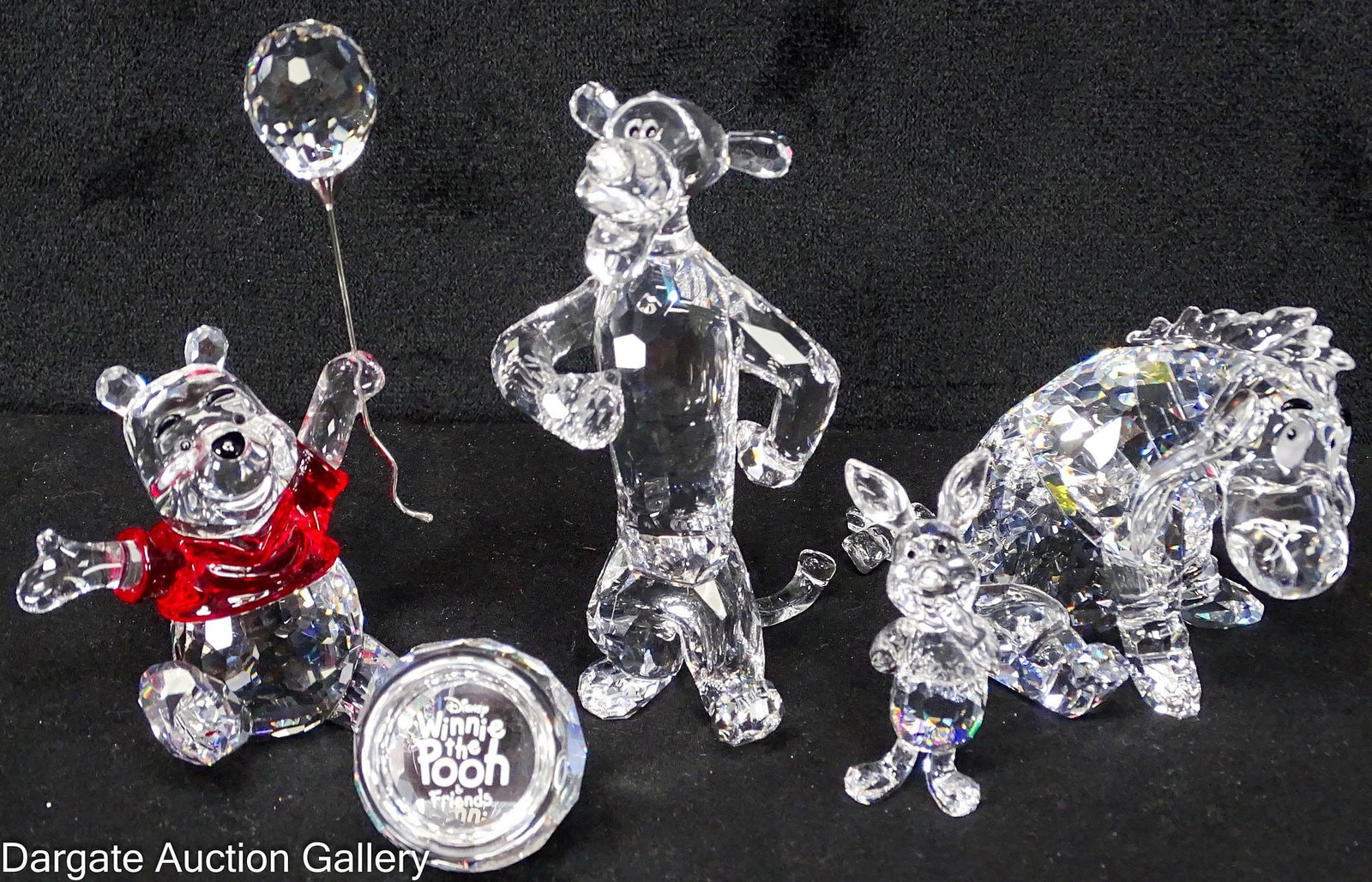 5pcs OF SWAROVSKI CRYSTAL WINNIE THE POOH SCENES: Includes: Eeyore, Tigger, Piglet, a honey pot that reads "Winnie the Pooh & Friends" and Winnie the Pooh in his iconic red shirt, holding a balloon; Measures: Range from 2"H x 4.25&