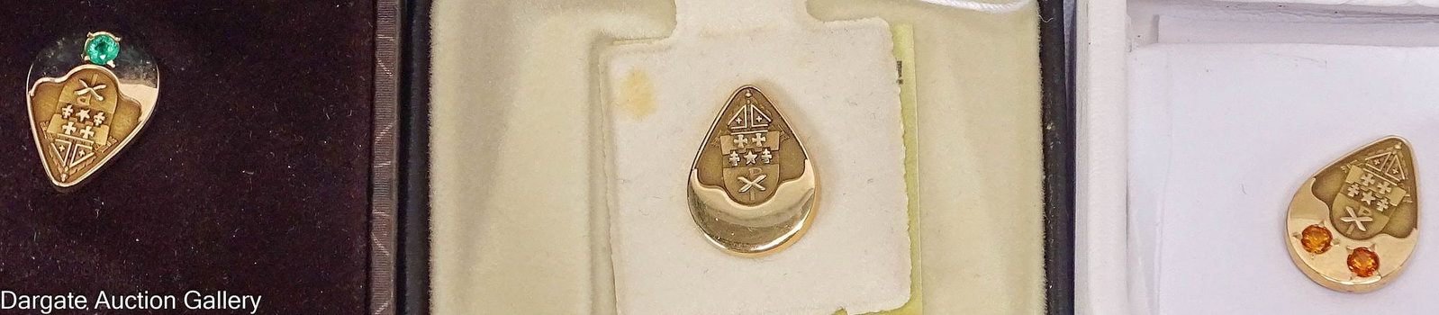 (3) 14k YELLOW GOLD POPE PAUL VI PAPAL AWARD PINS: (3) yellow gold Papal award pins, issued during Pope Paul VI's pontificate, all marked [14k], tear drop shaped with the papal coat of arms, (1) plain, (1) with 2 orange stones and (1) with 1 green