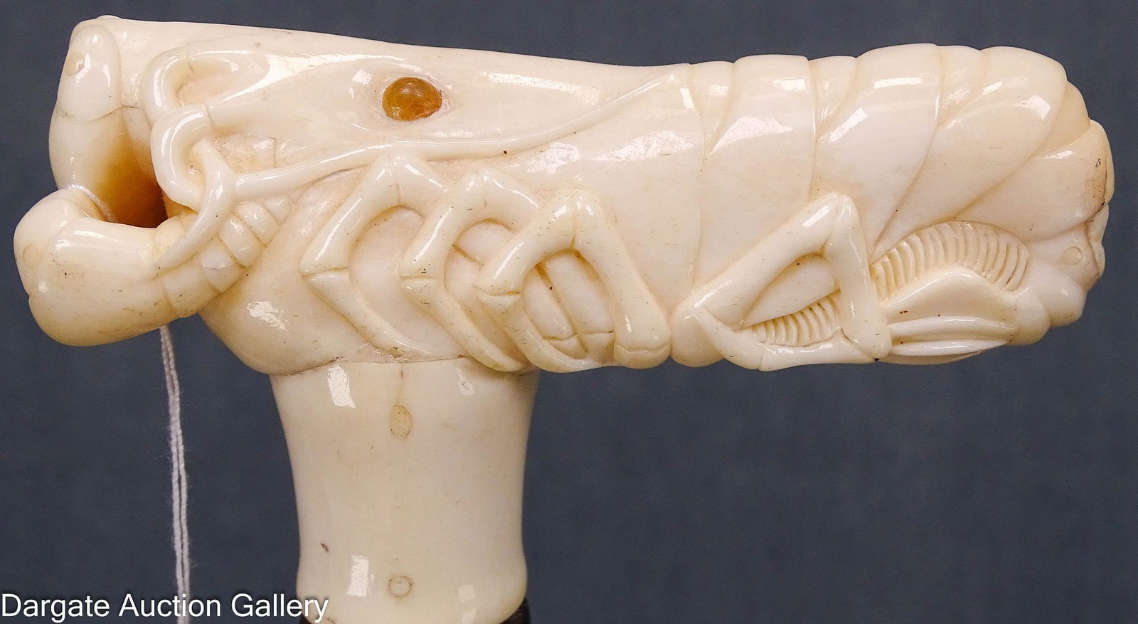 19th CENTURY CARVED LOBSTER GRIP CANE: Carved lobster, t-style handle; mahogany and rosewood frame with brass ferrule. Cane itself screws together in the middle; Measures - 35.75"L; Condition - piece missing from handle
