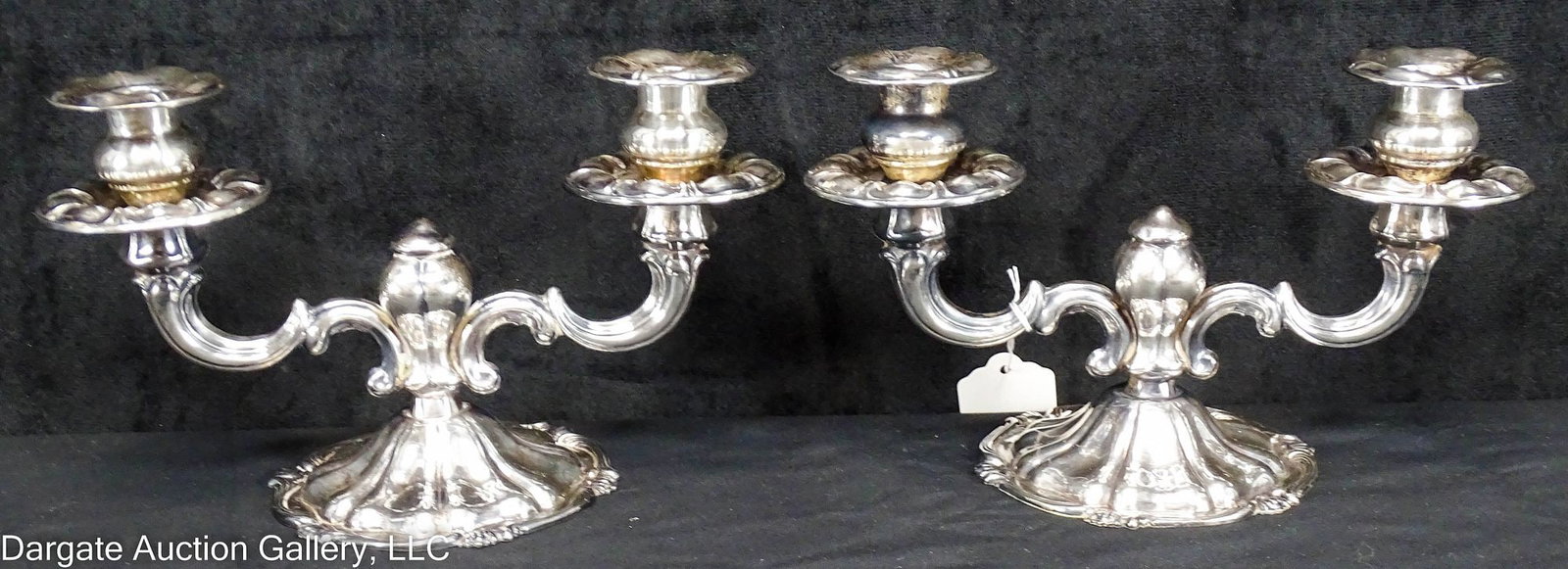 PAIR WEIGHTED STERLING CAMUSSO TWO-ARM CANDELABRAS: A Pair of Sterling 2-arm candelabras in the Waterlily pattern by Camusso; Marked, Weighted [Industria Peruana Plata Esterlina 925 Camusso] / Total Gross Weight: 30ozt/934g / Measurements: 5.5"H