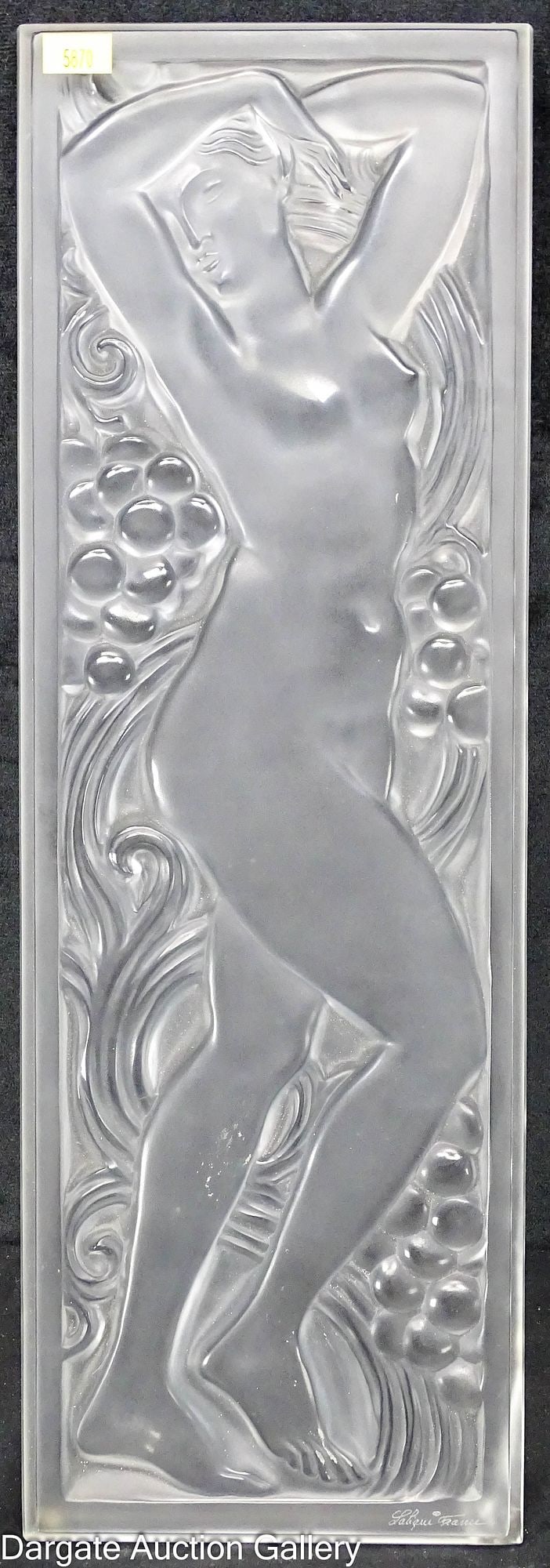 LALIQUE BACCHANTE NUDE GLASS PANEL: A frosted crystal panel depicting a nude woman surrounded by grapes and vines (Figurine et Raisins Tete Levee) signed [Lalique France]; Measures - 18"H x 6"W x .75"D; Condition - Chip