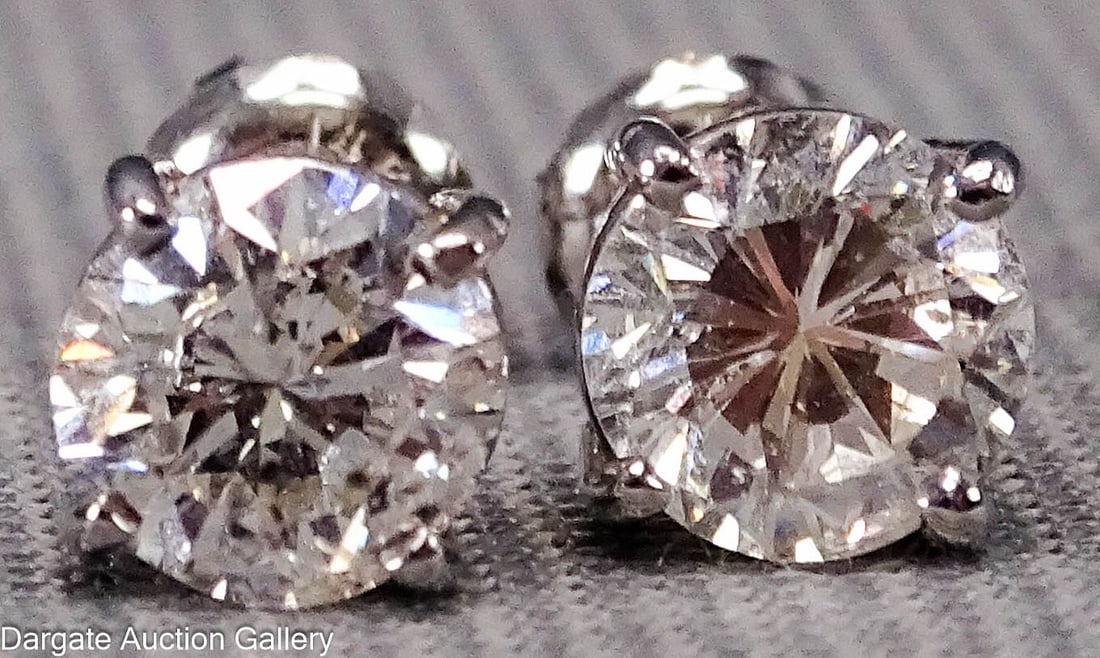 PAIR 14k WHITE GOLD 3.8 cttw DIAMOND EARRINGS: A pair of diamond solitaire stud pierced earrings with a screw on back; Round cut diamonds, 8mm diam, 5mm depth, approx 1.9ct each / 3.8 cttw, in a 14k white gold setting; total gross weight 1.7g