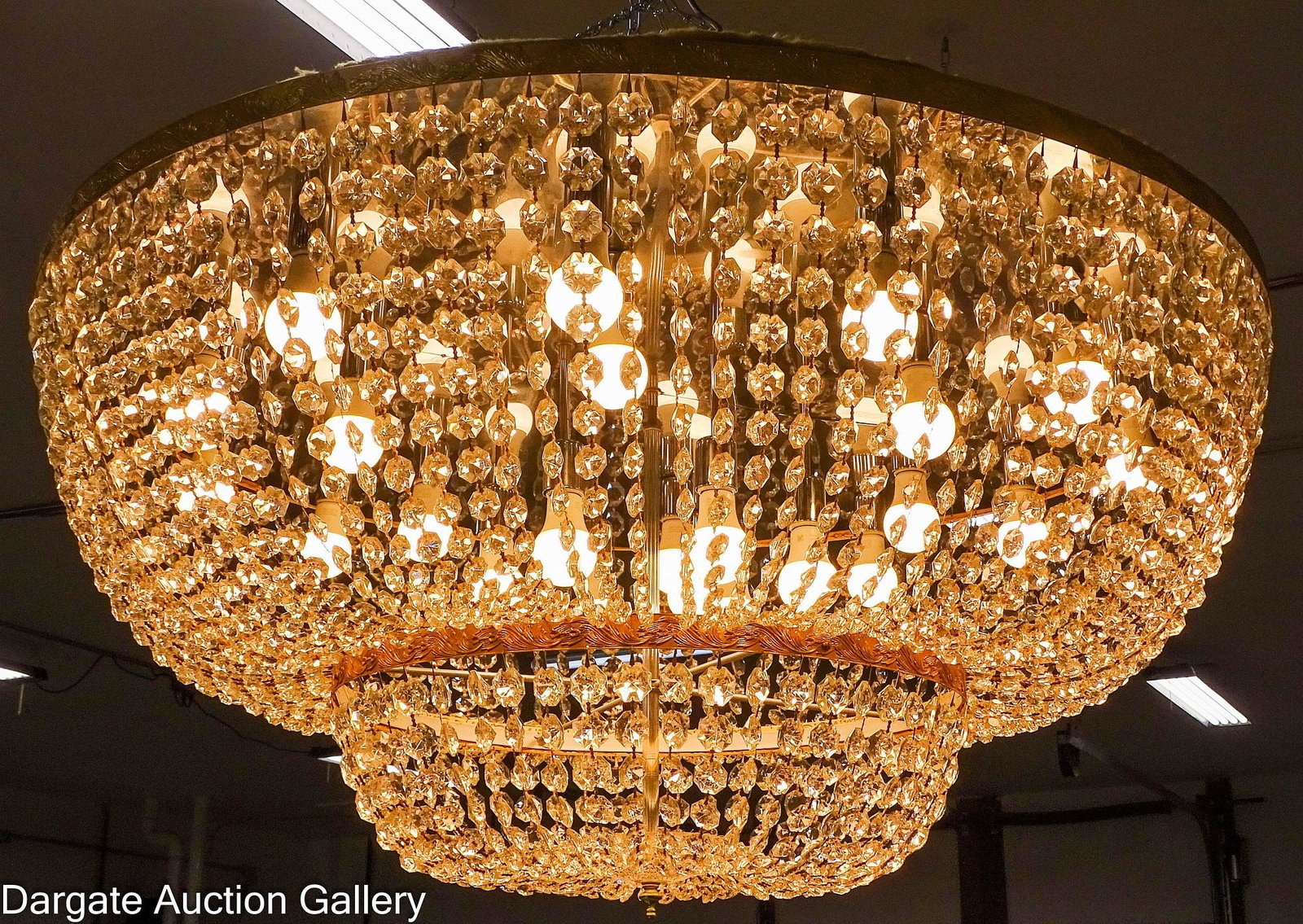 LARGE SUNSET DESIGNS CRYSTAL BASKET STYLE CHANDLIER: Flush mount 2-tiered brass framed crystal chandelier made by Sunset Designs, South Elmo California; Features strands of faceted bead lead crystals cascading down and gathered together at the glass