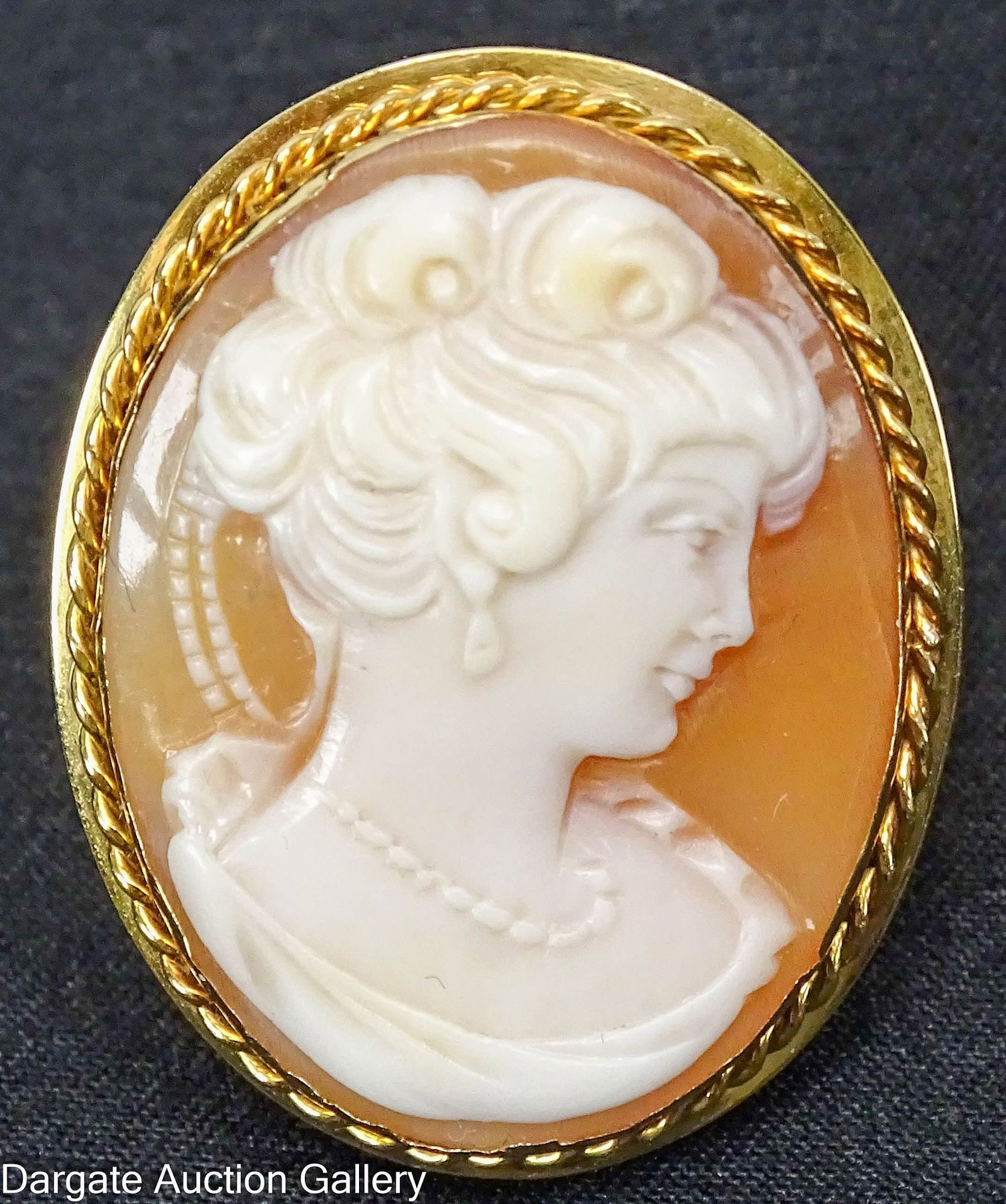 18k YELLOW GOLD CAMERO RING: Size 5.25; mark is worn [750]; cameo - 1"H x 0.5"W; Total Gross Weight: 9.7g