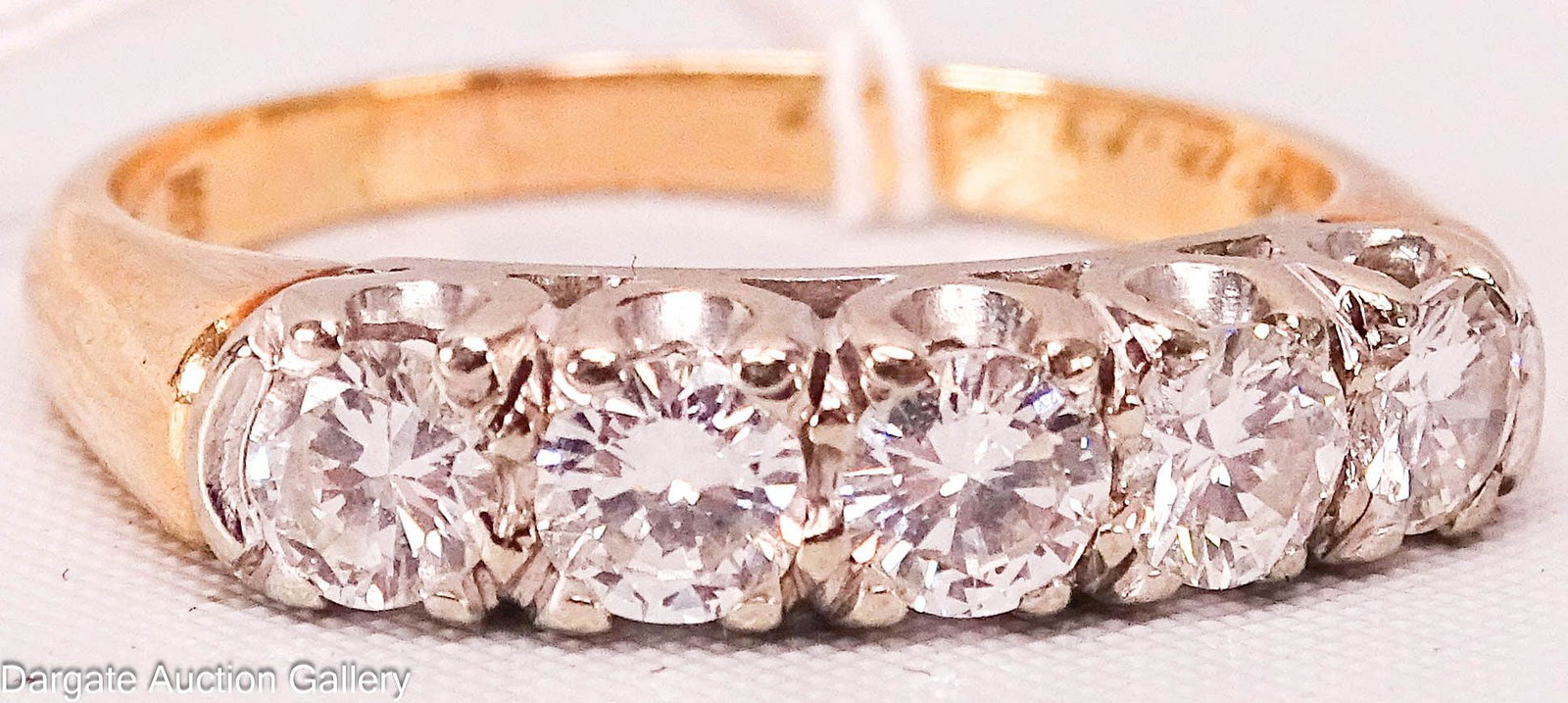 14k YELLOW GOLD 1 ct DIAMOND CHANNEL SET RING: 14k yellow gold band channel set with 5 diamonds (diamonds are set in white gold) approx 0.23 ct each, 1.5 cttw; marked [14k] with inscription; Measures: Size 7.5, Total Gross Weight - 3.3g