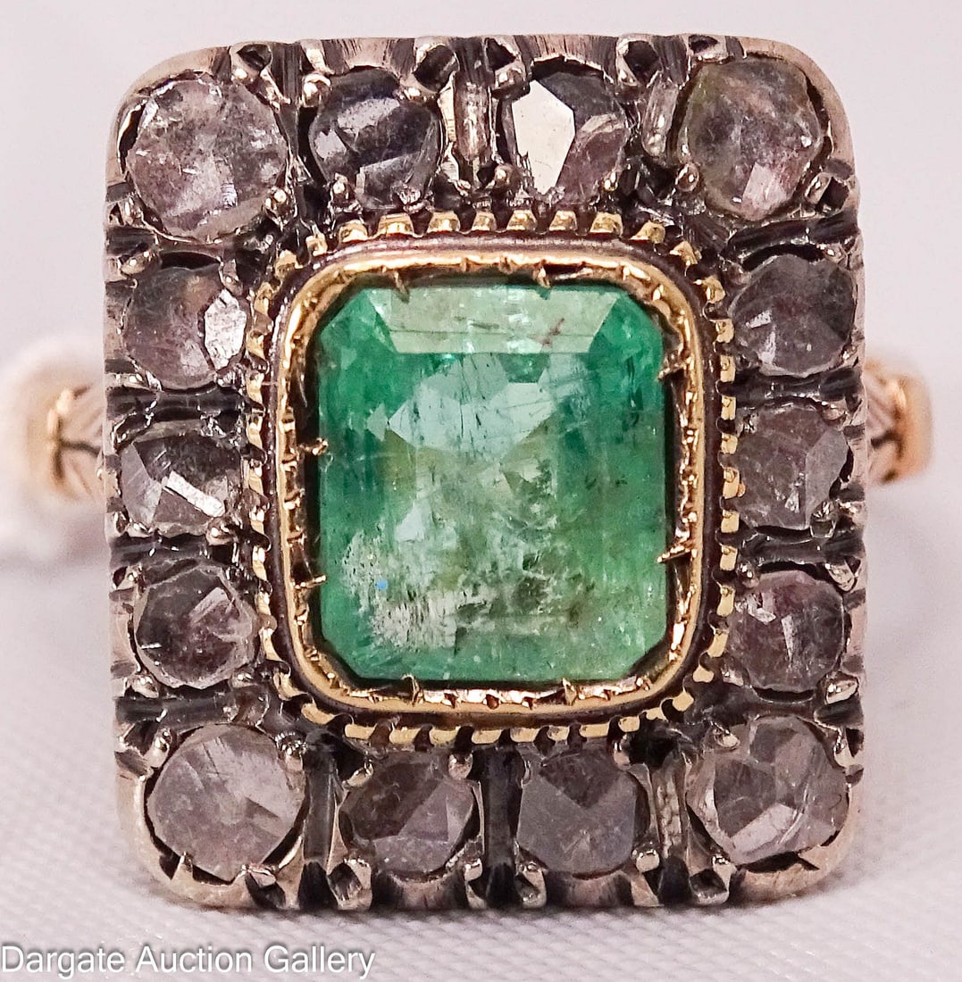 14k GOLD DIAMOND AND EMERALD RING: Emerald (7mm x 7mm) set in yellow gold, 14 diamonds set in white gold, yellow gold ring with feathered shanks; marked [14k]; Measures: Gross Total Weight - 5.4g, Size 5.5