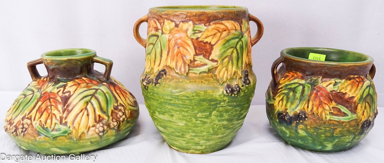 3pcs ROSEVILLE POTTERY BLACKBERRY VASES: 3 Art pottery vases made by Roseville in their blackberry pattern, circa 1932; all 3 are vase forms with handles; Measures: Squat - 4"H x 5.5/8" diameter, Tall - 6.25"H x 5"