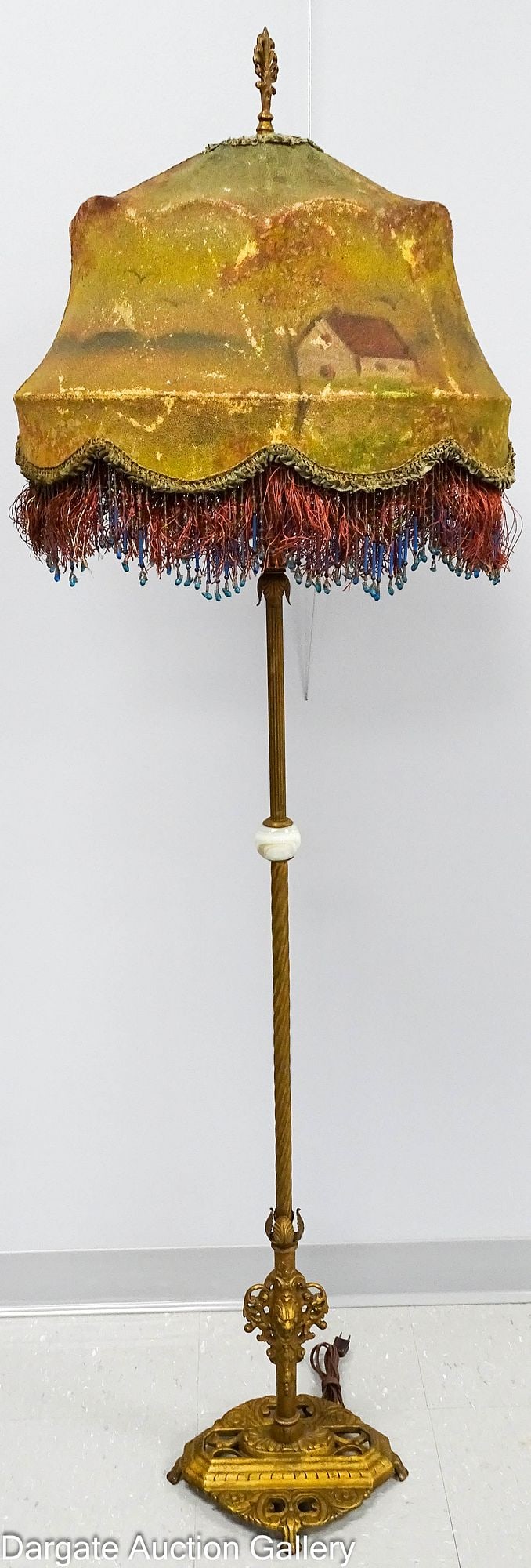 ART DECO CAST IRON W & E Co FLOOR LAMP CORALINE GLASS BEADED SHADE: Antique 1920's cast iron and brass floor lamp marked [PAT APPLY FOR W&E CO #] on base; cast iron parts have a gold finish; base is oval with piercings and paw feet; lion's head above base;