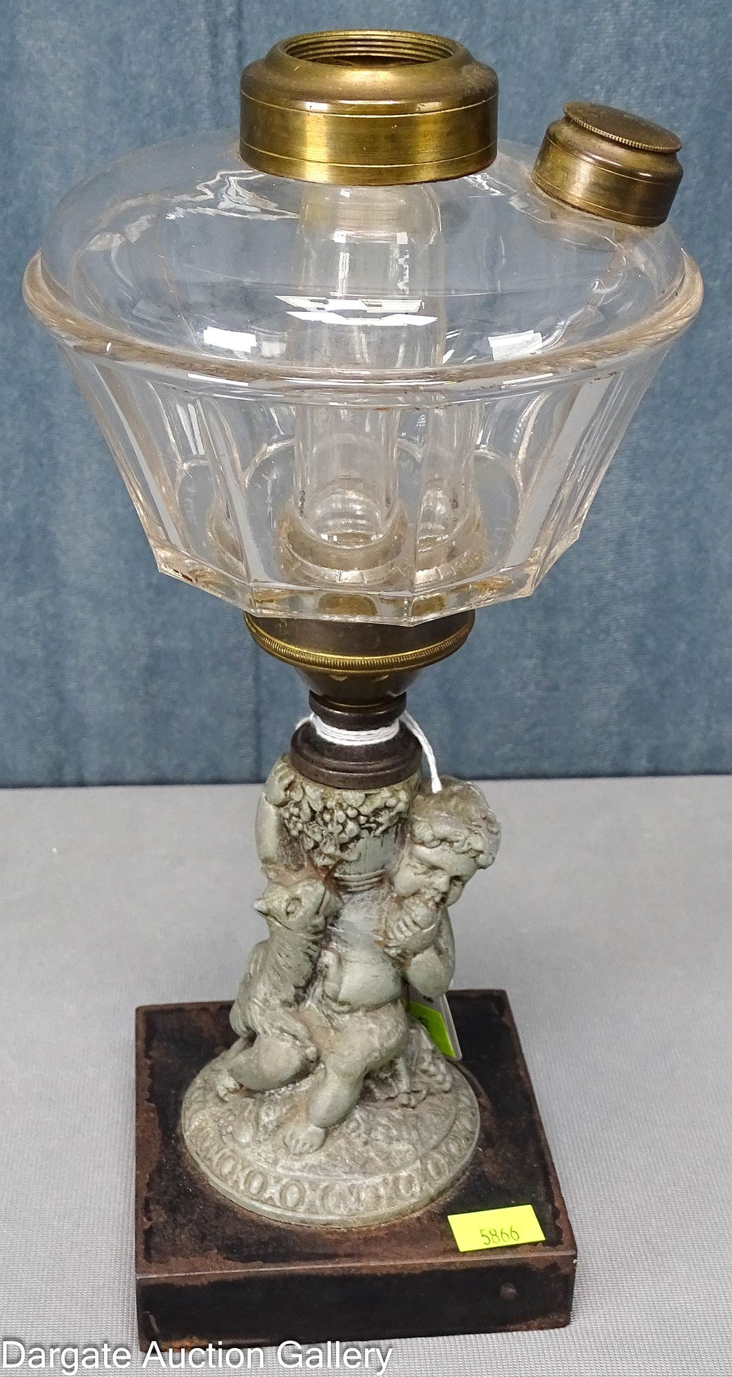 HOYT PERKINS HOUSE NON-EXPLOSIVE SAFETY LAMP: Rare patented "Non-Explosive" Safety oil lamp with a Hoyt plain panel colorless glass font on a Victorian spelter leaf cherub and brass connecting collar [PAT MARCH 14 1871] [JULY 23 1872]