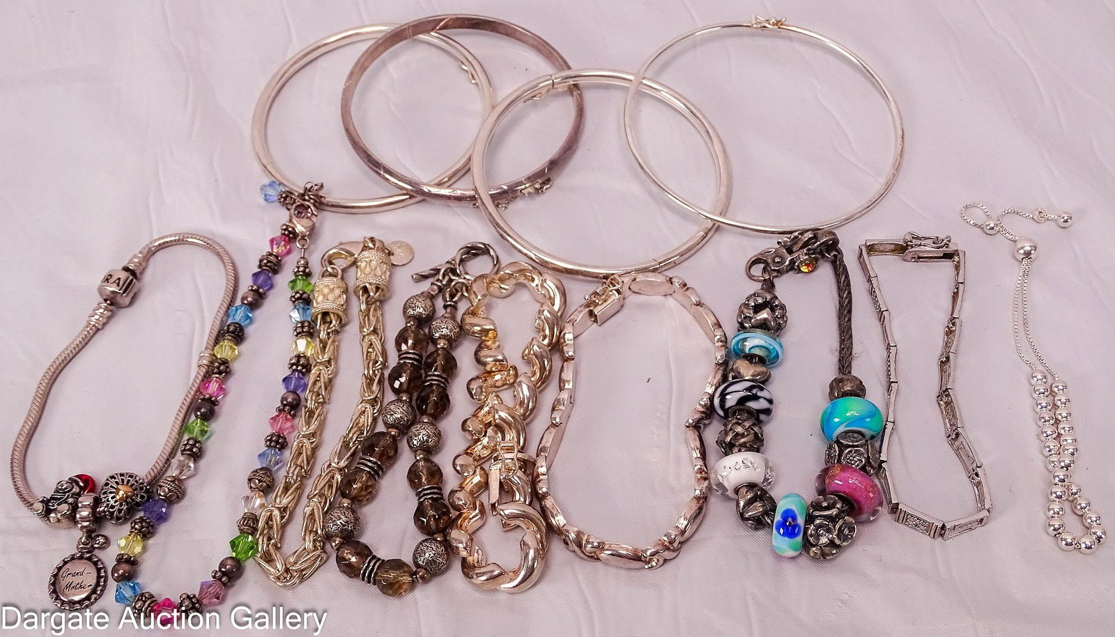 (13) STERLING BRACELETS: Includes: Hinge bangle with safety chain [925 worn], 2.5" diameter 7"L X's and O's style bracelet, box clasp with safety catch [925 ITALY] 7"L Macaroni link bracelet, box 