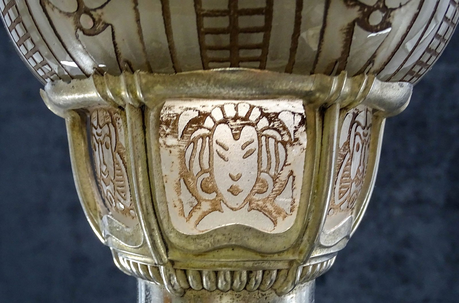 SILVERPLATE TORCHIERE FLOOR LAMP WITH STEUBEN SHADE: A spectacular Lightolier DaRay silverplate floor torchiere lamp with an openwork base and decorated column ending in a fluted carved and etched glass shade by Steuben with faces at the base and styliz