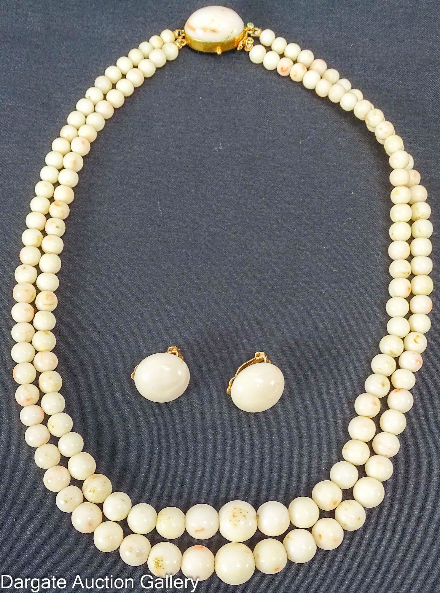 2pc YELLOW GOLD & WHITE CORAL BEAD JEWELRY SET: Set includes: 17"L Double strand graduated white coral beads with a large 18k yellow gold box clasp set with a large cabochon Pair of clip-on earrings with large coral cabochons [14k]