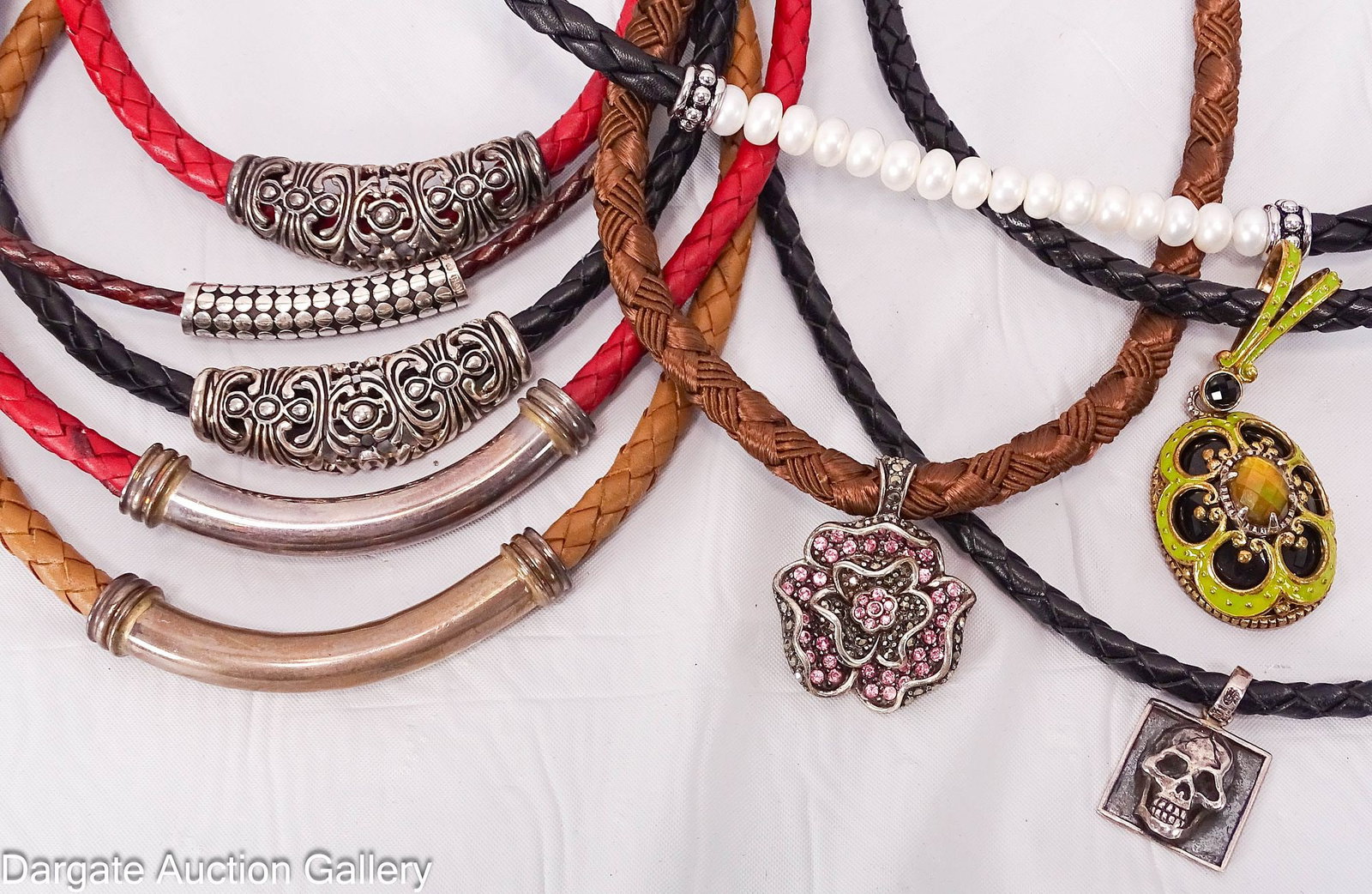 (9) LEATHER AND STERLING NECKLACES: Includes: Brown braided leather necklace with slide pendant, lobster claw clasp, 16-18"L; Pendant - [925 THAILAND] 8.3g, Clasp [925] David Sigal Momenti Mori necklace - black braided leather neck