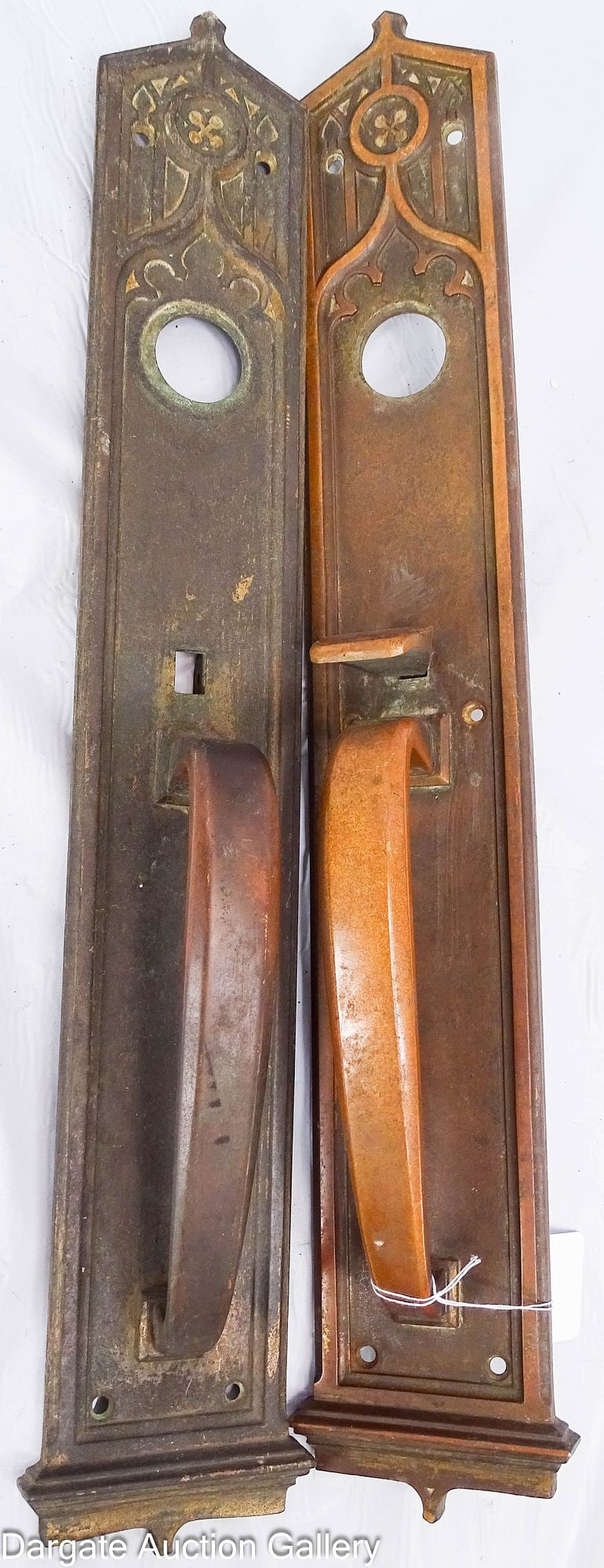 PAIR OF PENN HARDWARE GOTHIC COMMERCIAL DOOR PULLS: A pair of Penn Hardware (Reading, PA) copper Gothic style commercial door pulls with a bronze finish, circa 1915. / Dimensions: 20.5" H x 3.5" W x 2.5" D /