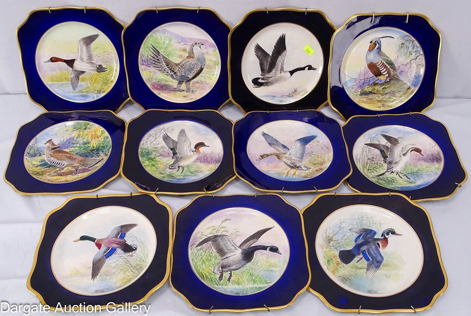 SET OF 11 PLATES PAINTED BY GEORGE WILMER RENBOLD: Set of 11 Lamberton Scammell plates painted by George Wilmer Reinbold (American/PA, 1885-1946) from Newton, Pennsylvania. Taught at the Philadelphia Museum School of Industrial Art. Birds painted on p
