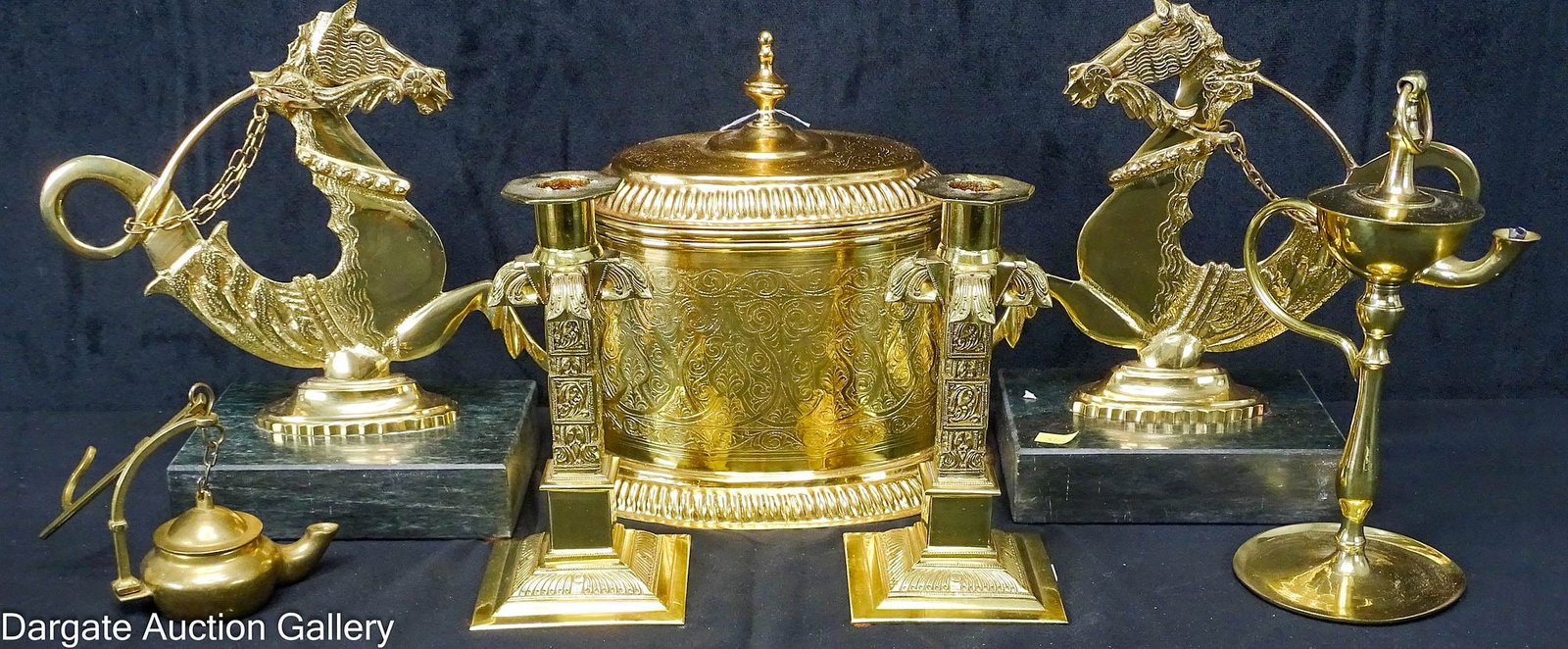 7pcs DECORATE BRASS ITEMS: Includes: Pair of Venetian Hippocampus (seahorse) oarlock style, bookends 10"H x 10"W x 4.75"D Pair of Ecclesiastical brass candlesticks 7"H x 3.75"W x 3.75"D