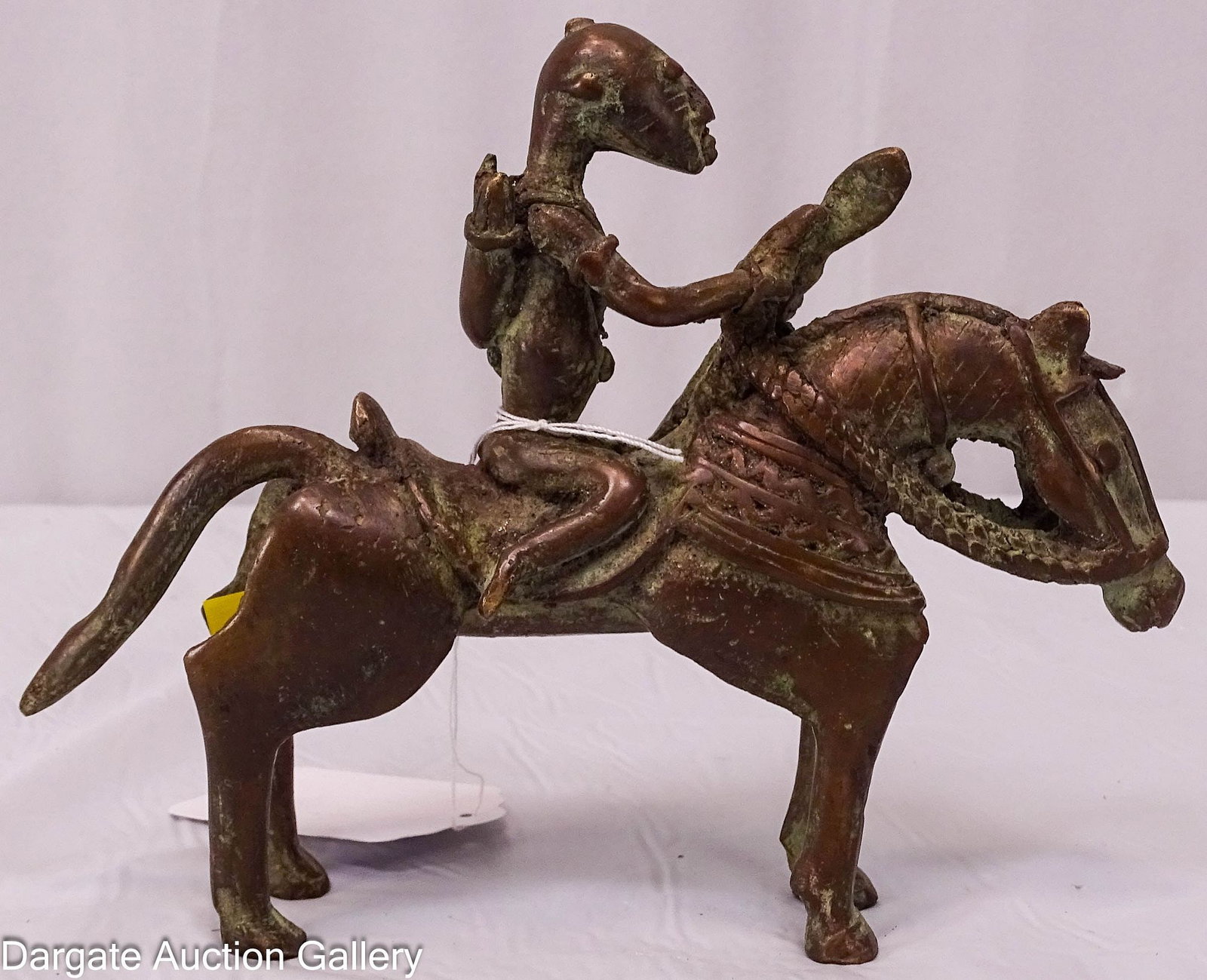 WEST AFRICAN BRONZE HORSE AND RIDER: Stylized bronze figure of a warrior on horseback from either the Dogon people of Mali or the Senufo people of the Ivory Coast. Represents either the "Syonfolo" in Senufo culture or the