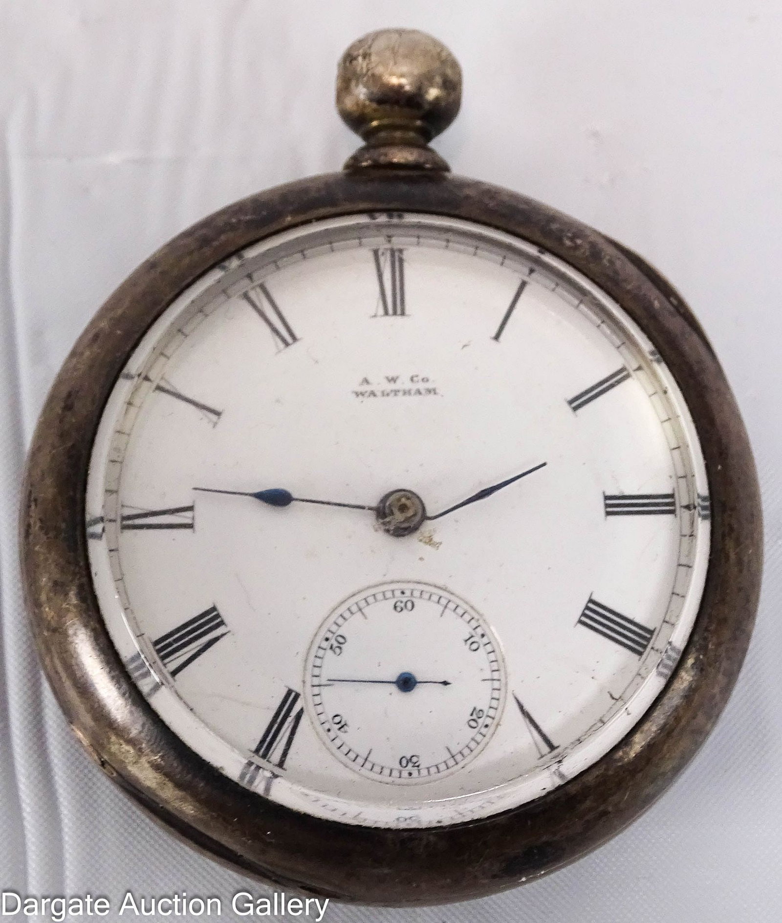 DUEBER COIN SILVER POCKET WATCH: Porcelain face pocket watch marked [A.W. Co WALTHAM], interior case marked [DUEBER COIN 170507], and the works are marked [KEYSTONE PAT PINION 1.389926]; Measures - Case with crystal weighs 87g with
