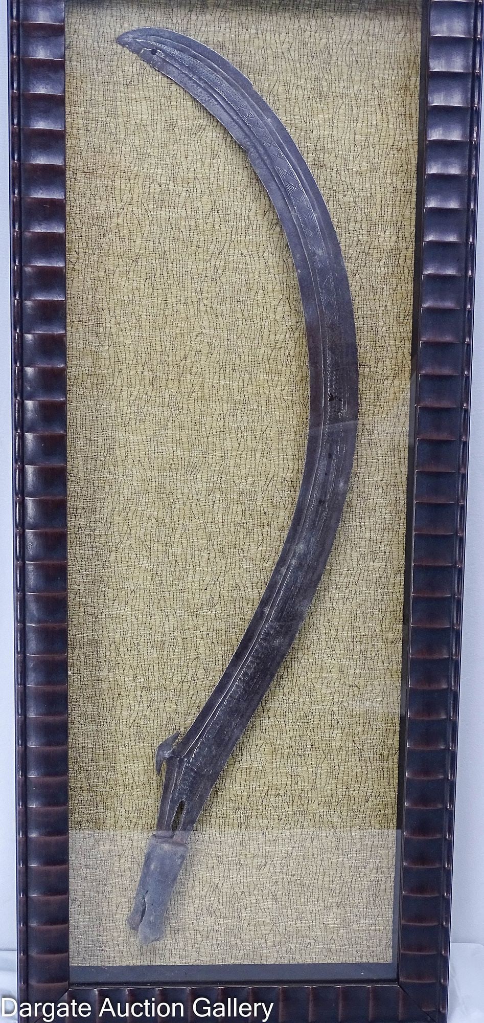 BOA / ZANDE CURVED SABER AZANDE: An African curved saber from the Boa, Zande, or Mambele peoples of the Sudan and Central African Republic. The blade features a linear design and a raised crescent form at the interior; accented with