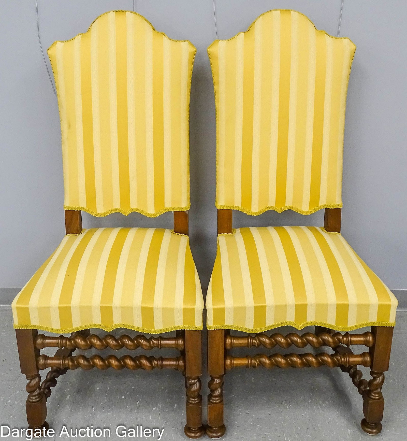 PAIR TRANSITIONAL CHAIRS LOUIS XIII TO LOUIS XIV: Pair of Louis XIII to Louis XIV style transitional side chairs with high backs and turned legs with barley twist stretchers, in a gold striped upholstery; Measures: 48.5"H x 22.5"W x 19"
