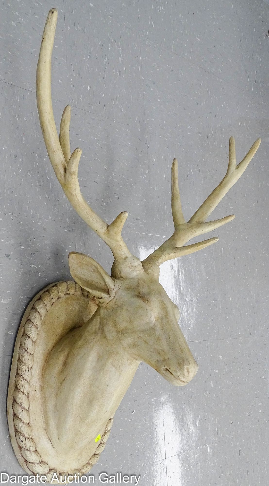RESIN WALL MOUNTED DEER HEAD SCULPTURE: Decorative faux deer head mount made from sculpted resin with muted details; features a bracket for hanging / Dimensions: 36" H x 29" W (across antlers) x 14" D.