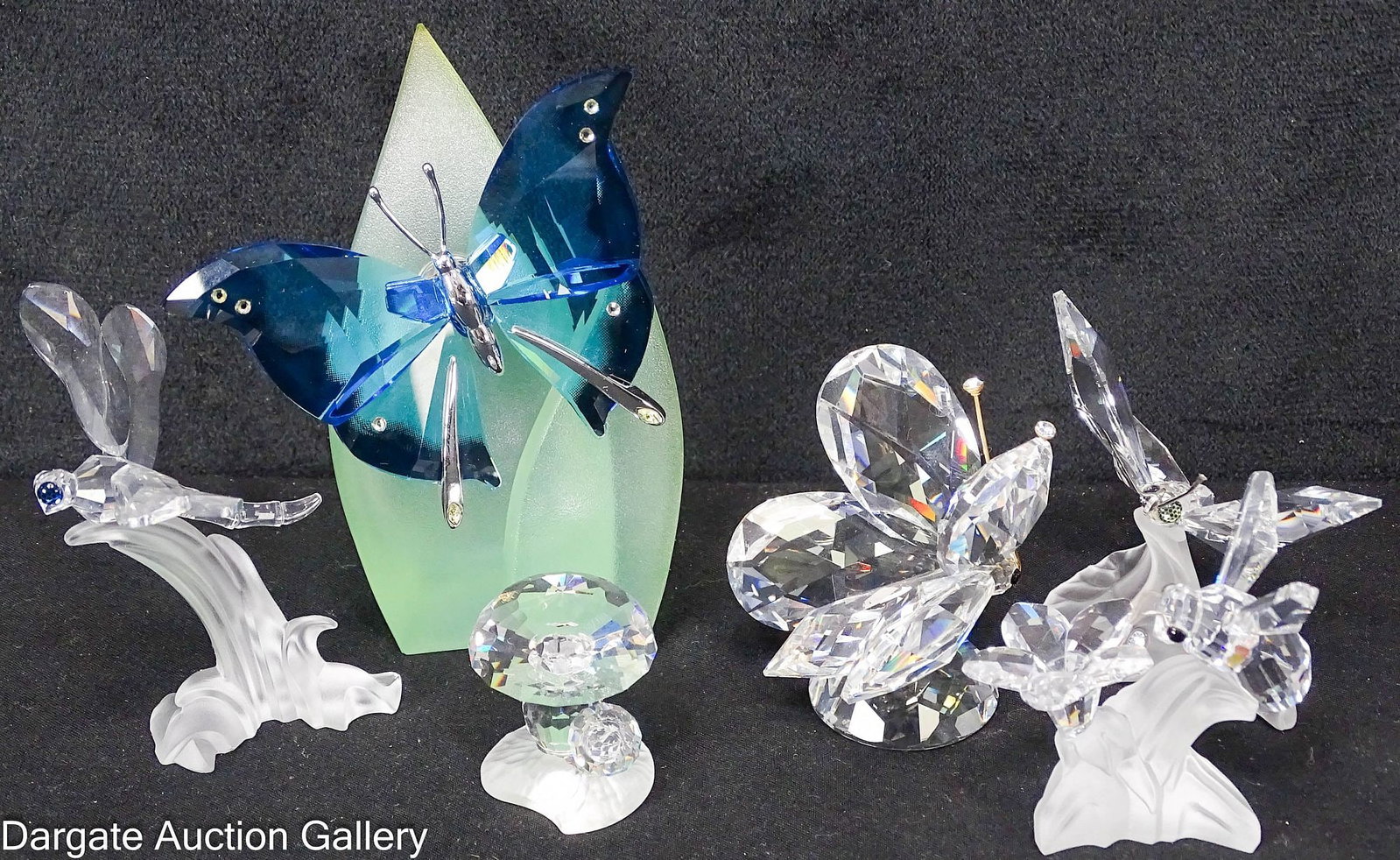 (6) ASSORTED SWAROVSKI CRYSTAL FINGURES incl INSECTS: Includes: Mushroom, a colored butterfly (attached to a green plastic base), a crystal butterfly, a crystal moth, a crystal dragonfly and a crystal bee; Measures: 1.25"H x 4"H