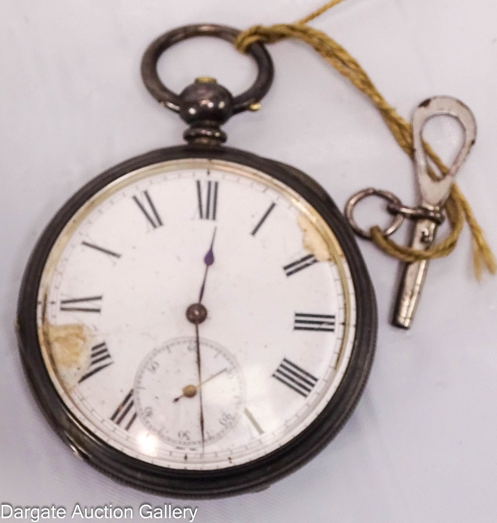 FINE ENGLISH SILVER POCKET WATCH WITH KEY: A porcelain faced pocket watch, case marked [FINE SILVER] with engraving and engine turning on reverse; the inside reads [J.W. Benson to HRH The Prince of Wales 58 & 60 Ludgate Hill, London] This 