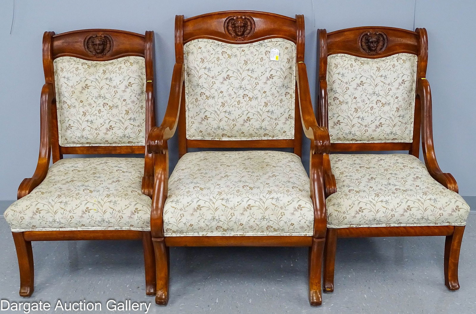 3pc VICTORIAN MAHOGANY PARLOR SUITE: Renaissance Revival parlor suite; mahogany with empire style curved arms and arched crest rails; carved with a woman's head, saber legs; Measures - Armchair - 40.5"H x 25"W x 23"D; Side Chair - 38"H x