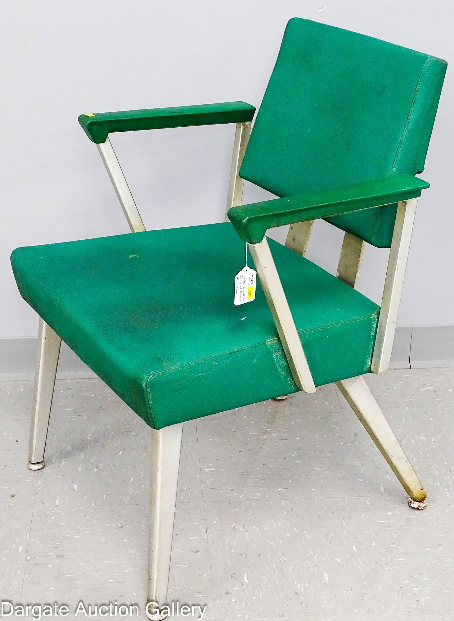 VINTAGE GOOD FORM BRUSHED ALUMINUM ARMCHAIR: A vintage Good Form brushed aluminum armchair, upholstered in green vinyl; Measures: 31.5"H x 22"W x 19"D; Condition - Soiling to vinyl, scuffing to metal, corrosion on foot pads