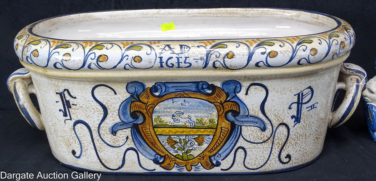(2) ITALIAN POTTERY PLANTERS: (2) Hand Painted Italian pottery plants, one with attached ring handles in a polychrome scrolled design; one with lion handles in a blue and white floral motif; Measures: Largest - 6.5"H x