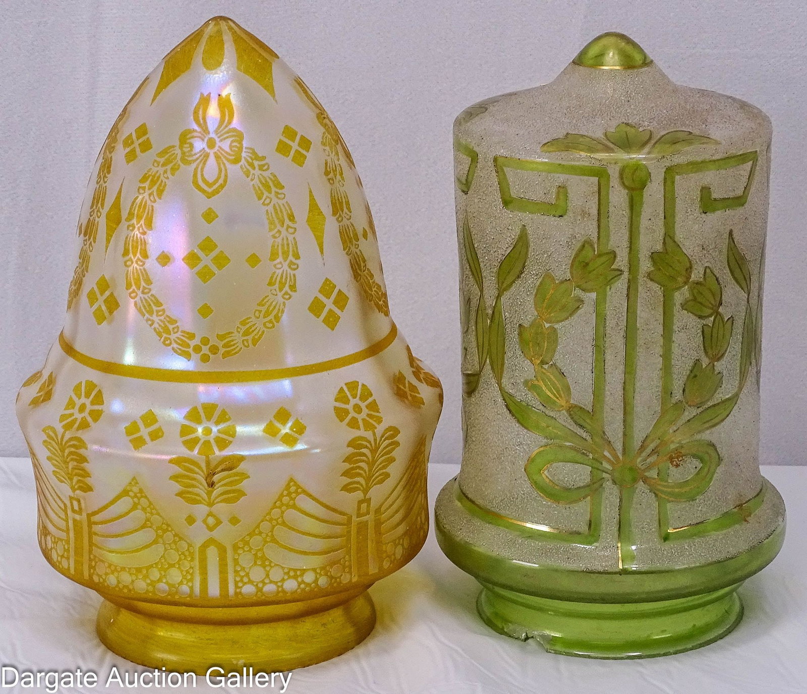 (2) ASSORTED GLASS PENDANT SHADES: (2) Art Deco pendant glass shades, one cylindrical with white textured design, green staining with gold highlights, chip to the 3" fitter, soiling and paint splatters; the other has an acorn