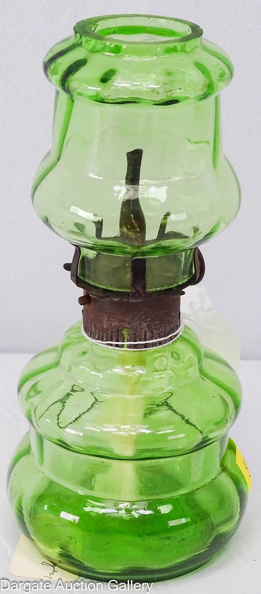MINIATURE ALCOHOL OIL LAMP GREEN GLASS EUROPEAN: Most likely German miniature green glass alcohol oil lamp with original matching shade; burner is marked [DRGM] Deutsches Reichsgebrauchs Muster and shade features a ground top and bottom / Di