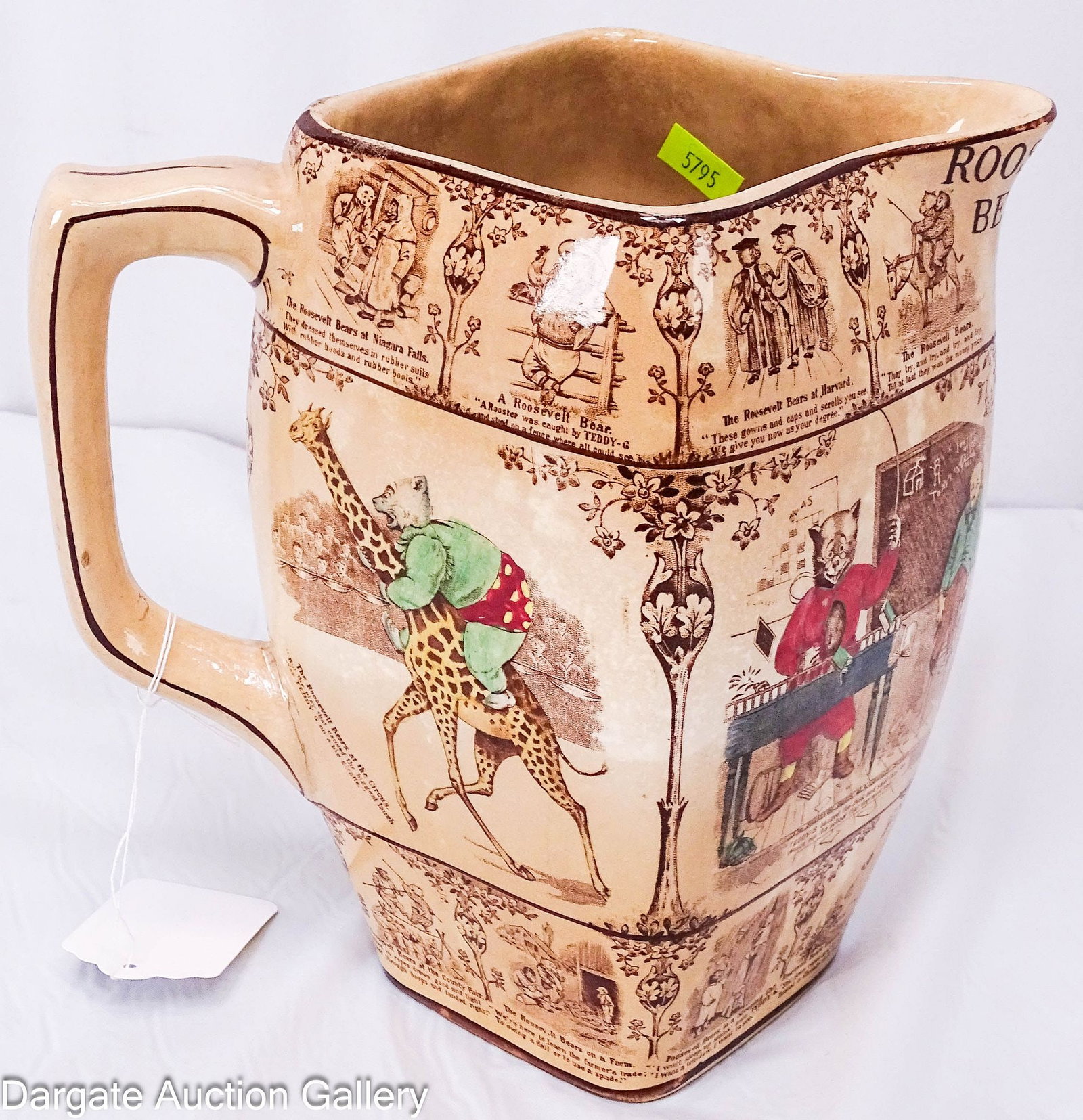 1907 BUFFALO POTTERY ROOSEVELT BEARS PITCHER: Large Buffalo Pottery Pitcher featuring scenes from the Roosevelt Bears. (4) large colored transferware scenes around middle, the Roosevelt Bears at Country School, the circus, at home and takin
