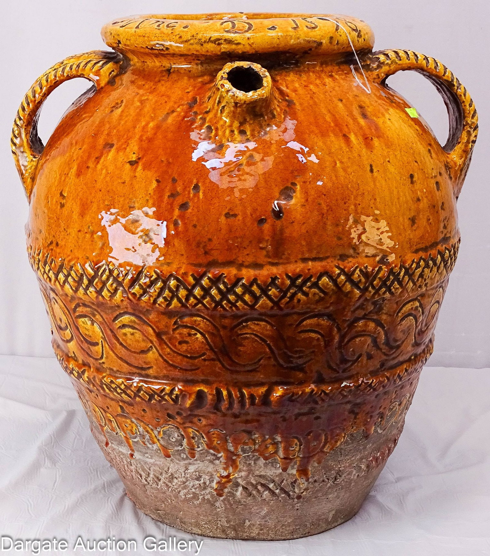 ITALIAN DRIP GLAZE POTTERY JUG: An Italian pottery jug decorated with crosshatched bands and geometric patterns, with a caramel colored drip glaze; 20th Century reproduction; Measures: 20"H x 20"W