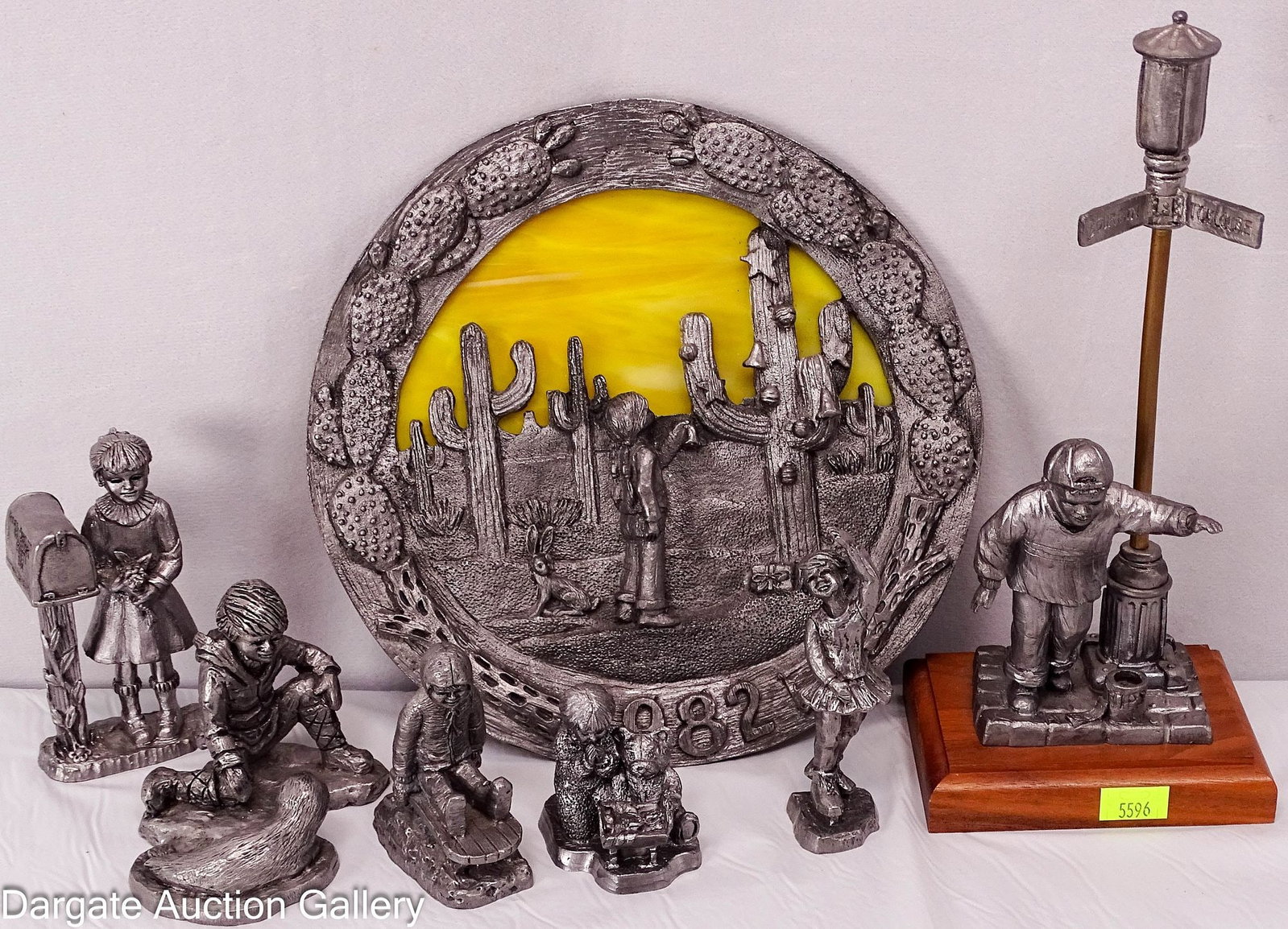 7pcs MICHAEL RICKER PEWTER FIGURES: Including the 1982 Southwestern Christmas plate (8.5" diameter), a boy with a seal, a sledding boy, a praying girl with teddy bear, a ballerina, an 1984 Ricker-Bartlett Collector's Society pi