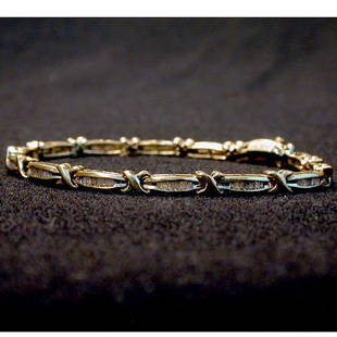 10K DIAMOND BRACELET. Bracelet has alte: 10K DIAMOND BRACELET. Bracelet has alternating gold crosses and square cut diamonds. Total diamond weight is approximately 1-2 ct. Total bracelet weight is approximately 11.7 g. Bracelet length is