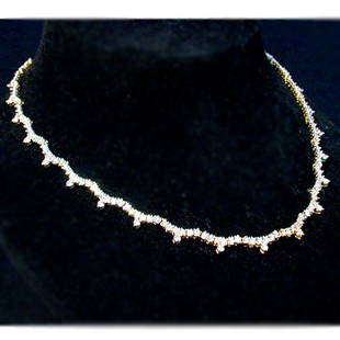 14K DIAMOND CHOKER. The choker style ne: 14K DIAMOND CHOKER. The choker style necklace has round cut diamonds mounted in a yellow gold setting. Total diamond weight is approximately 7.0 ct. Total necklace weight is approximately 25.8 g.