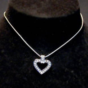 14K HEART PENDANT NECKLACE. The necklac: 14K HEART PENDANT NECKLACE. The necklace has round cut diamonds mounted in a white gold heart pendant suspended from a chain. Total diamond weight is approximately .75 ct. Total necklace weight is