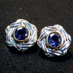 CEYLON BLUE STONE EARRINGS N/R. The pie: CEYLON BLUE STONE EARRINGS N/R. The pierced earrings have bezel cut stones mounted in 14K and sterling settings. Condition: no visible defects.
