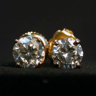 DIAMOND STUD EARRINGS. The pierced back: DIAMOND STUD EARRINGS. The pierced back earrings are mounted in 14K yellow gold settings. Total diamond weight is approximately 1.20 plus ct. Color: J. Clarity: SI3/I1. Condition: no visible defects.