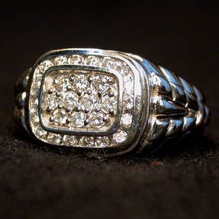 MAN'S 14K DIAMOND RING. The ring has ro: MAN'S 14K DIAMOND RING. The ring has round cut cluster diamonds in a white gold setting. Total diamond weight is approximately 1.0 ct. Condition; no visible defects.