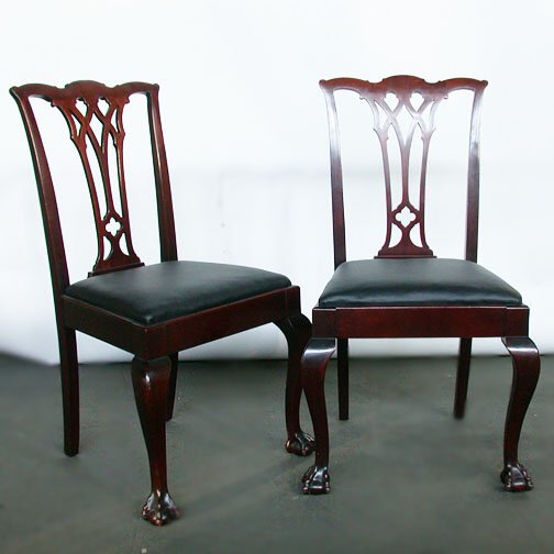 FOUR CHIPPENDALE STYLE CHAIRS. Mahogany: FOUR CHIPPENDALE STYLE CHAIRS. Mahogany, having the "Philadelphia splat" where you can see the soaring Gothic design which influenced Thomas Chippendale's design. The emphasis is on the vertical which