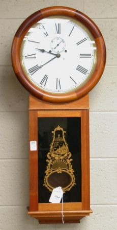 REGULATOR WALL CLOCK. Key wind pendulum clock wei: REGULATOR WALL CLOCK. Key wind pendulum clock weight driven, pendulum window has black glass with gold decoration. Size'' 35''H, 14''Diam. face. Condition: minor wear, sold as is.