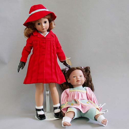 1194 TWO DOLLS N/R. One is an Effanbee: 1194 TWO DOLLS N/R. One is an Effanbee hard plastic girl doll dressed in a red coat and hat. The other is a hard plastic baby doll "Dreamkid" by Heidi Ott. Estimate: $75-100.